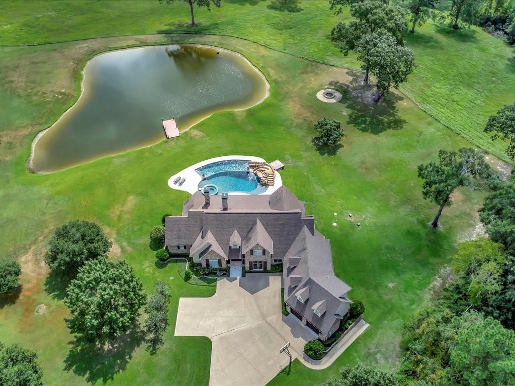 1811 Caspers Cv Road Lufkin, TX 75904 - Photo 5 of 40 an aerial view of a house with pool yard and outdoor seating