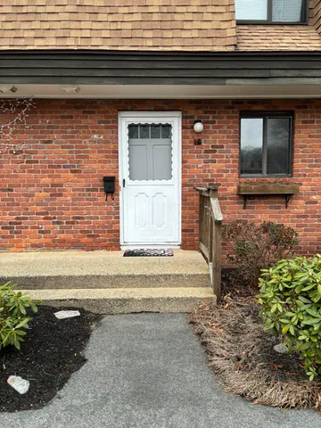 a view of a brick house with a window