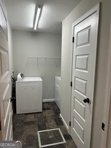 a utility room with a washer and dryer