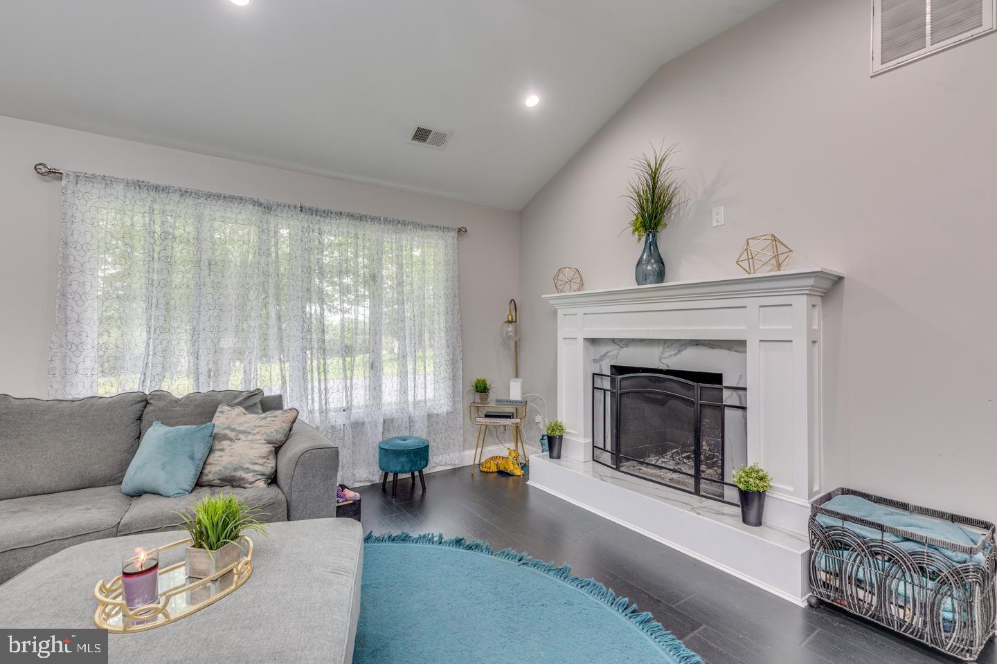 332 Juliustown Road Columbus, NJ 08022 - Photo 11 of 65 a living room with furniture and a fireplace