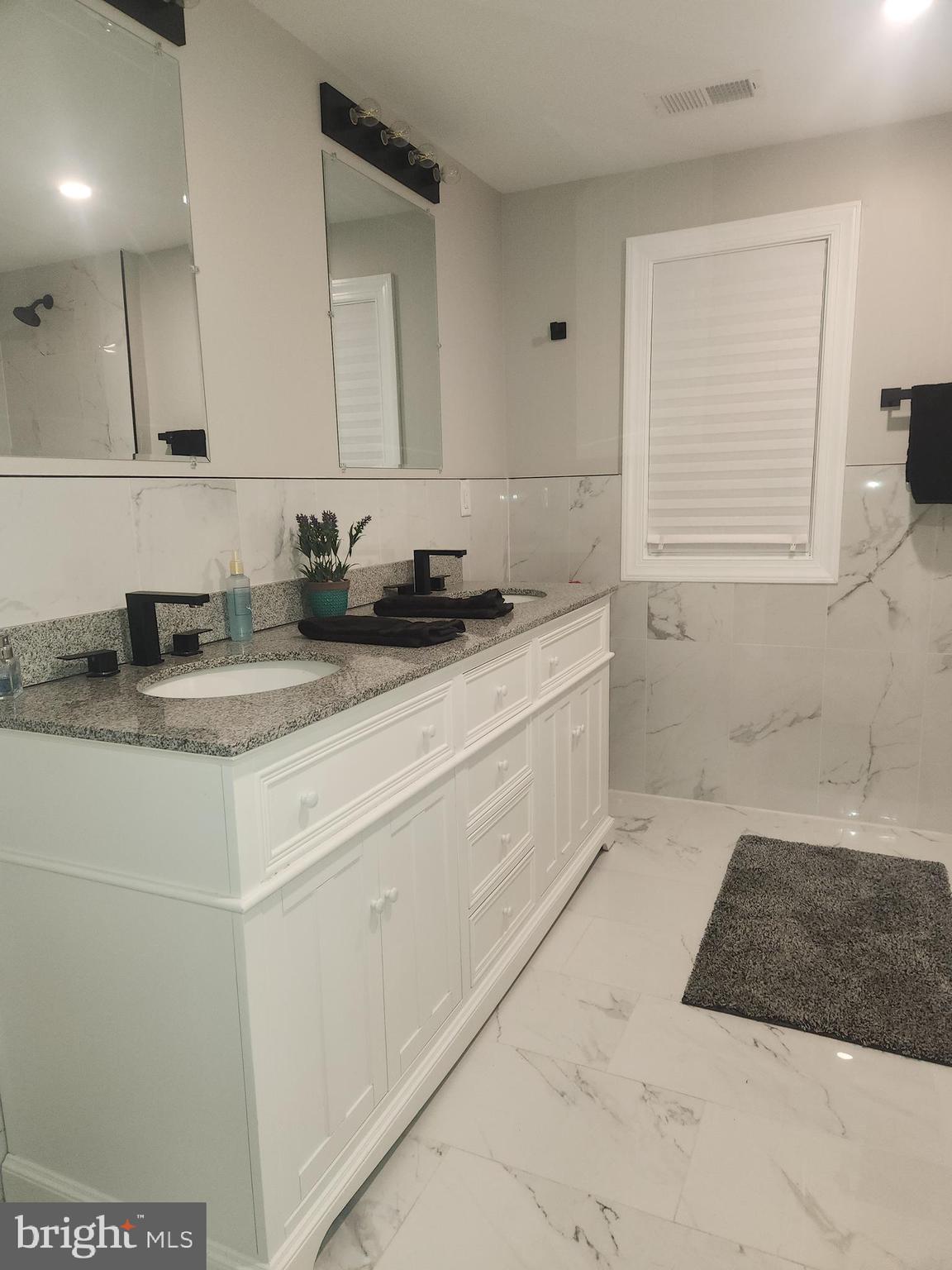 332 Juliustown Road Columbus, NJ 08022 - Photo 31 of 65 a bathroom with a sink a vanity and mirror