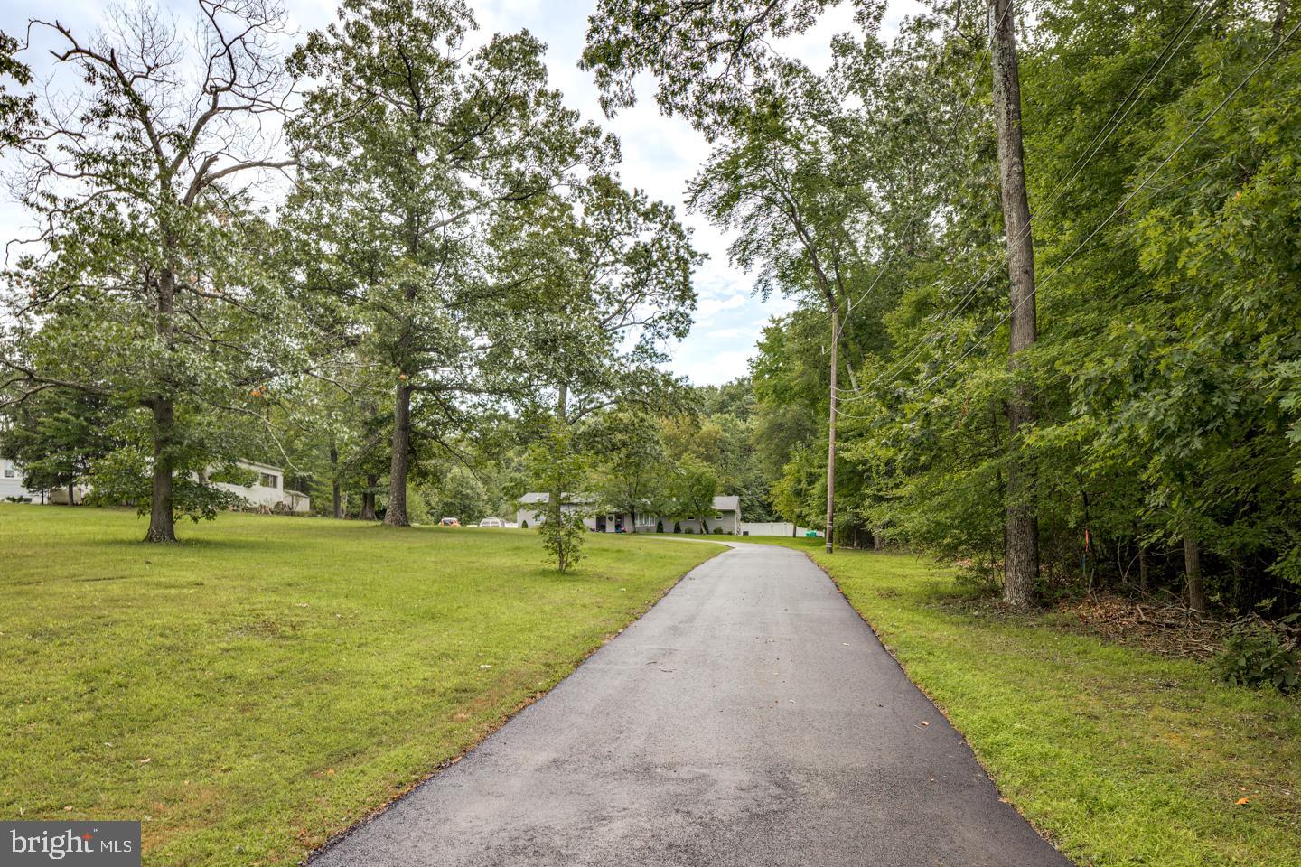 332 Juliustown Road Columbus, NJ 08022 - Photo 5 of 65 a view of a golf course with a garden