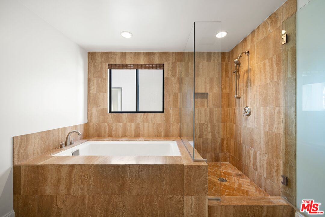 130 Ocean Park Boulevard, Unit 431 Santa Monica, CA 90405 - Photo 14 of 17 a bathroom with a bathtub and a shower
