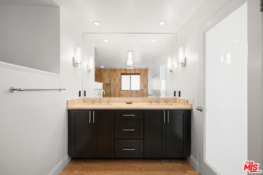 130 Ocean Park Boulevard, Unit 431 Santa Monica, CA 90405 - Photo 15 of 17 a bathroom with a sink and a mirror