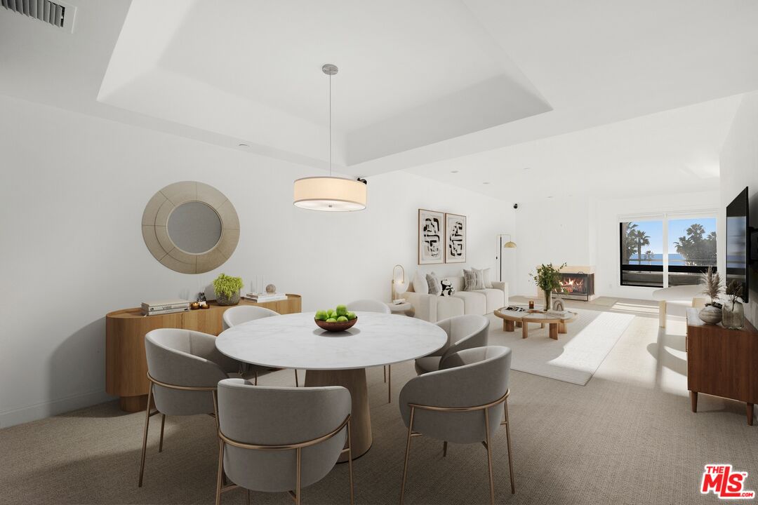 130 Ocean Park Boulevard, Unit 431 Santa Monica, CA 90405 - Photo 5 of 17 a view of a dining room with furniture and chandelier