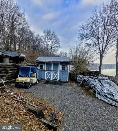 a view of a car parked in back of a house