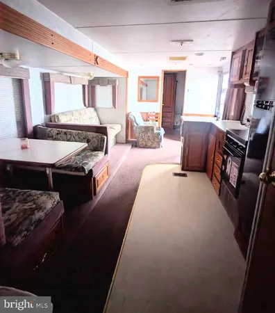 a living room with furniture window and a flat screen tv