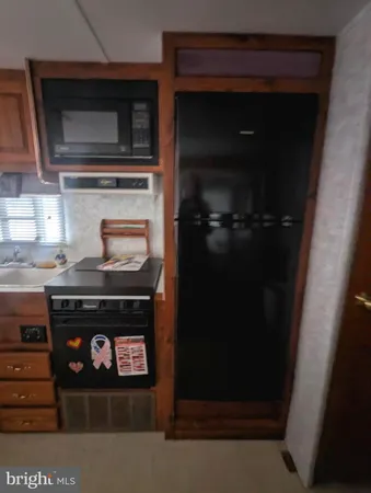 a kitchen with a stove and a microwave