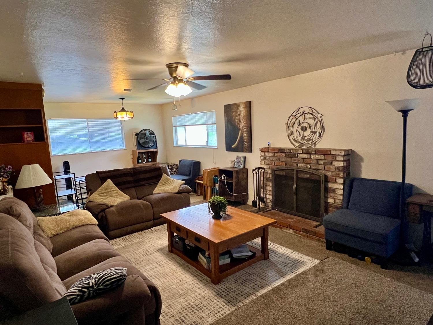 2101 Parr Avenue Modesto, CA 95358 - Photo 8 of 20 a living room with furniture a rug and a chandelier