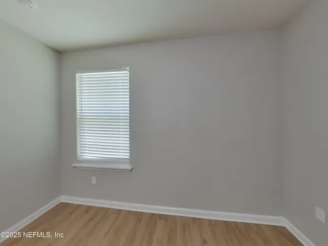 a view of a room that has a window in it
