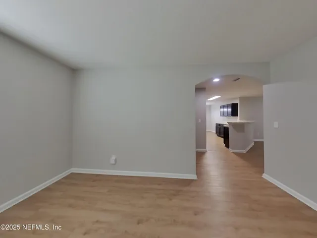 a view of a livingroom with wooden floor