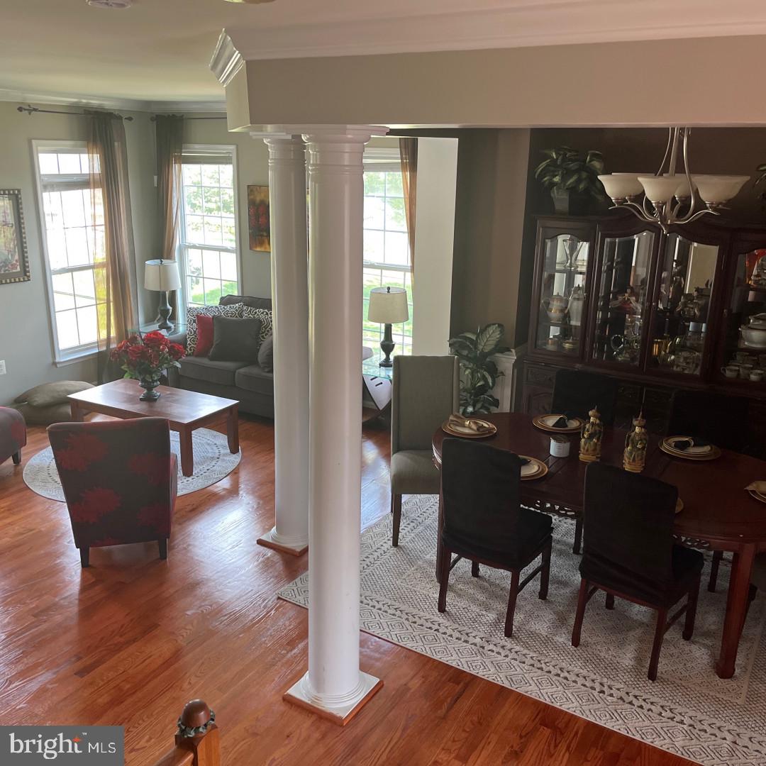 17696 Possum Point Road Dumfries, VA 22026 - Photo 5 of 45 a view of a dining room with furniture window and wooden floor