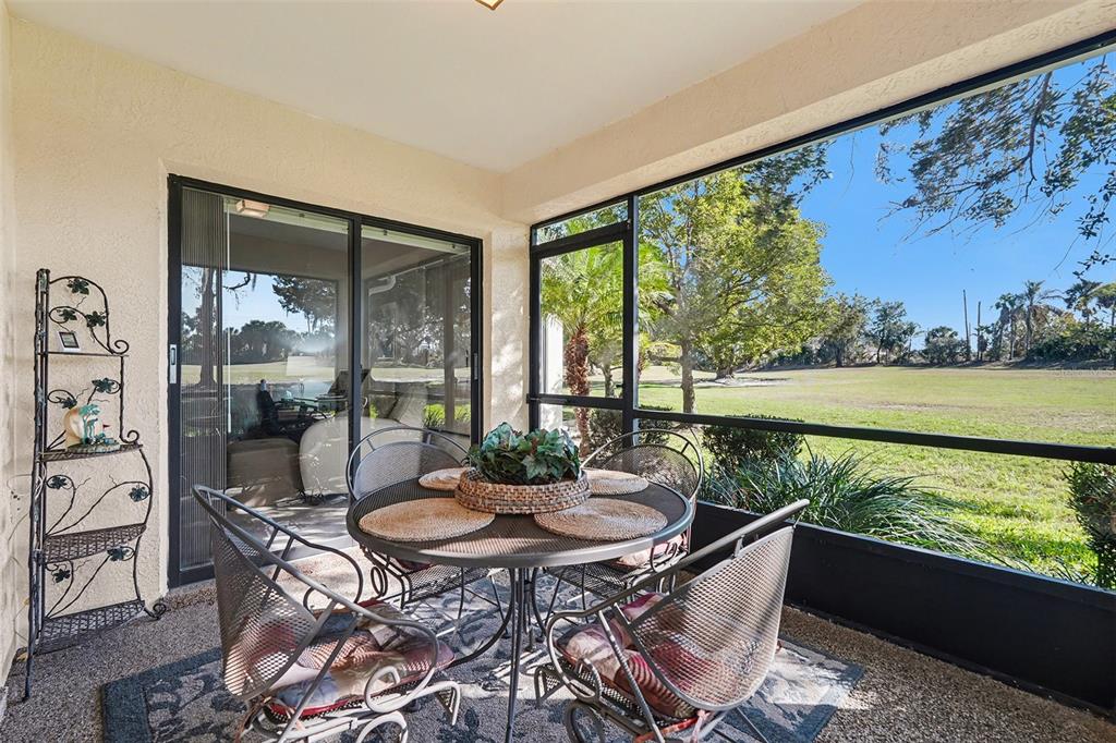 9130 Bassett Lane New Port Richey, FL 34655 - Photo 3 of 41 a outdoor dining space with furniture and garden view