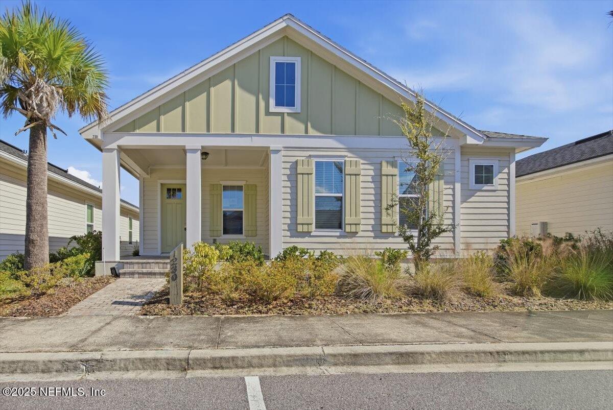 230 Julep Street Yulee, FL 32097 - Photo 1 of 24 a front view of a house with garden
