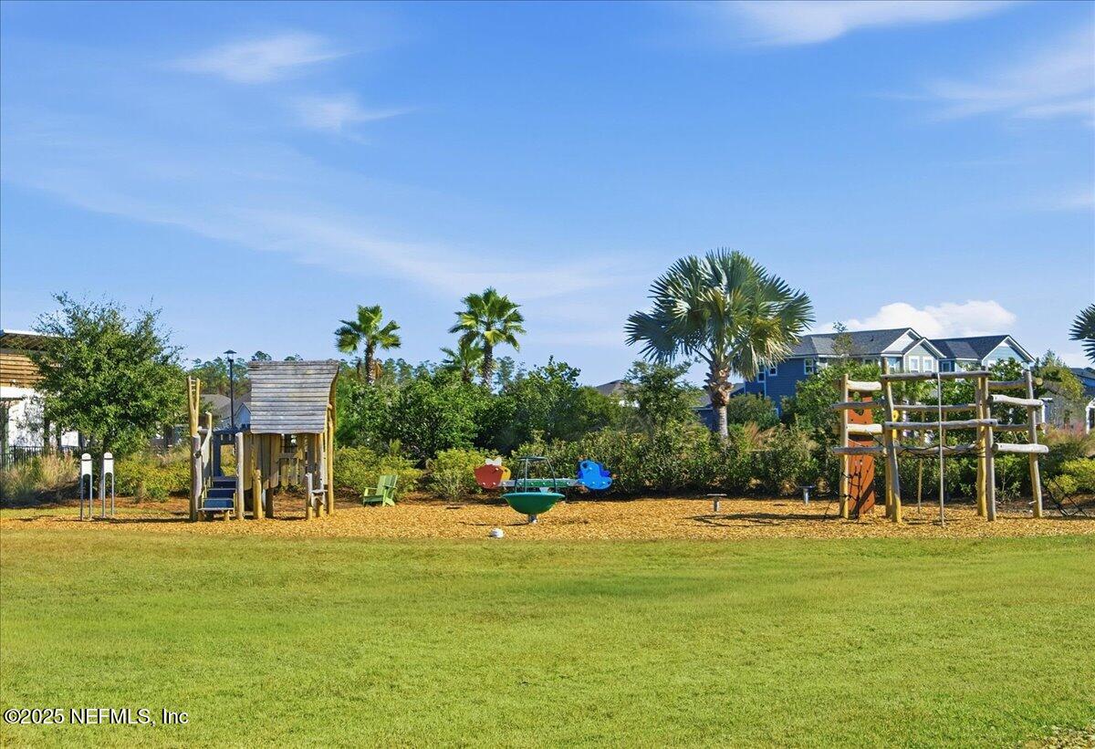 230 Julep Street Yulee, FL 32097 - Photo 19 of 24 a front view of a building with garden