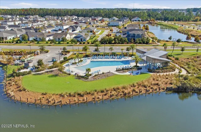 an aerial view of residential houses with outdoor space swimming pool and ocean view
