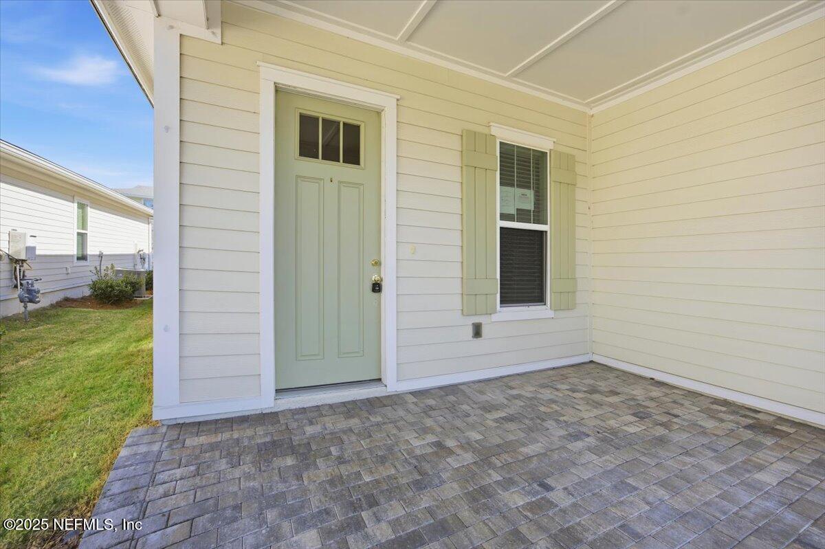 230 Julep Street Yulee, FL 32097 - Photo 2 of 24 a view of an entrance to house with a yard