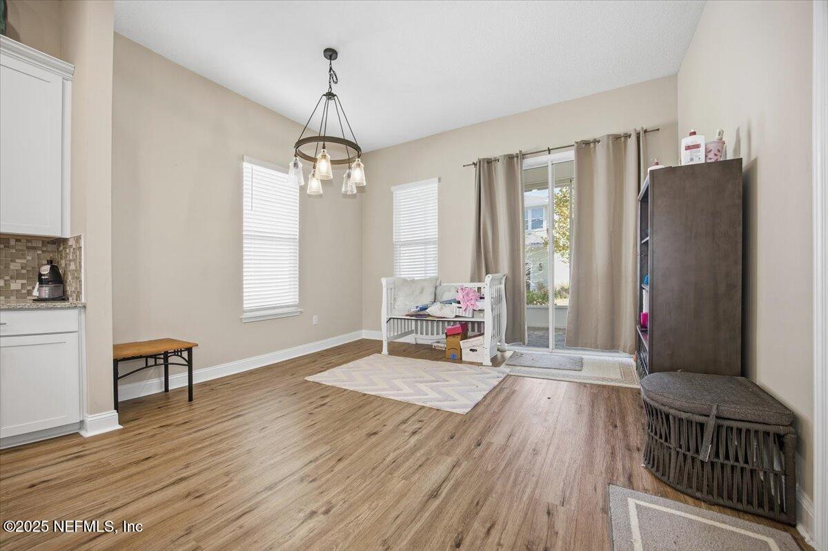 230 Julep Street Yulee, FL 32097 - Photo 6 of 24 a living room with furniture window and wooden floor