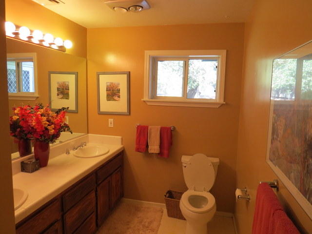 17410 Bowman Road Cottonwood, CA 96022 - Photo 4 of 24 a bathroom with a sink mirror vanity and toilet