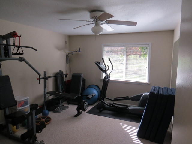 17410 Bowman Road Cottonwood, CA 96022 - Photo 5 of 24 a room with gym equipment and a window