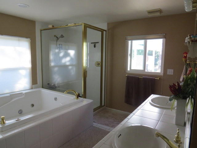 17410 Bowman Road Cottonwood, CA 96022 - Photo 8 of 24 a bathroom with a bathtub and shower
