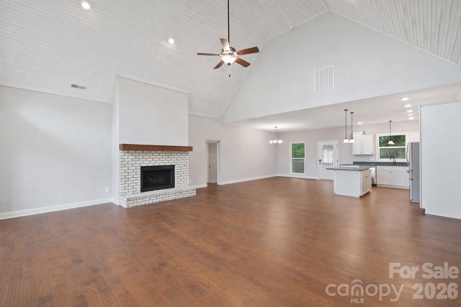 771 Sally Gap Road Old Fort, NC 28762 - Photo 12 of 44 a view of an empty room with a fireplace