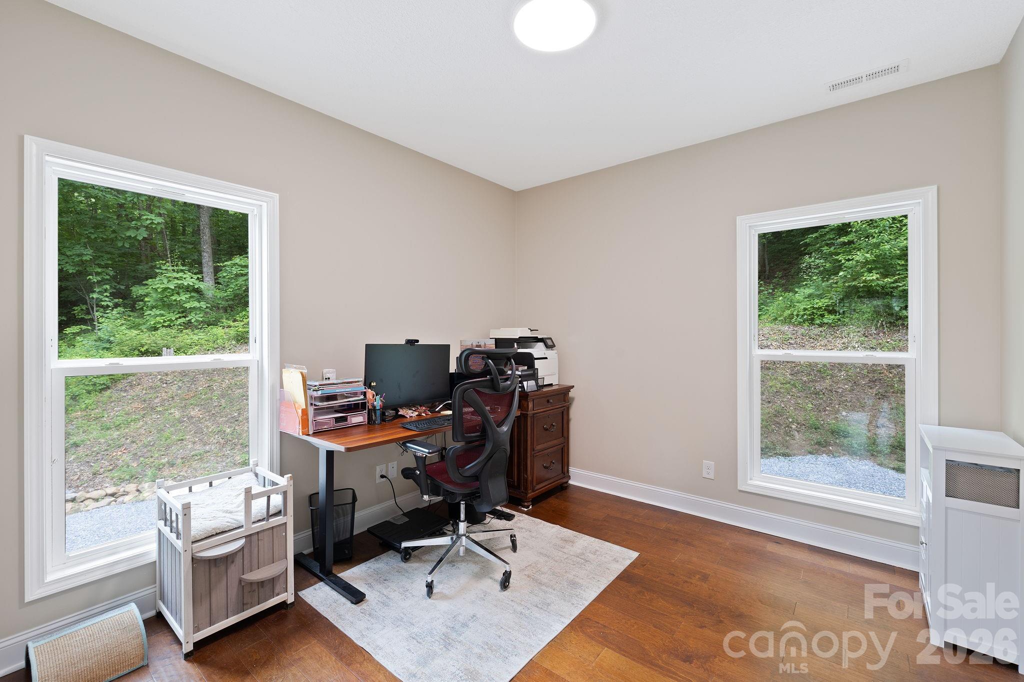 771 Sally Gap Road Old Fort, NC 28762 - Photo 18 of 44 a view of a workspace with furniture and a window
