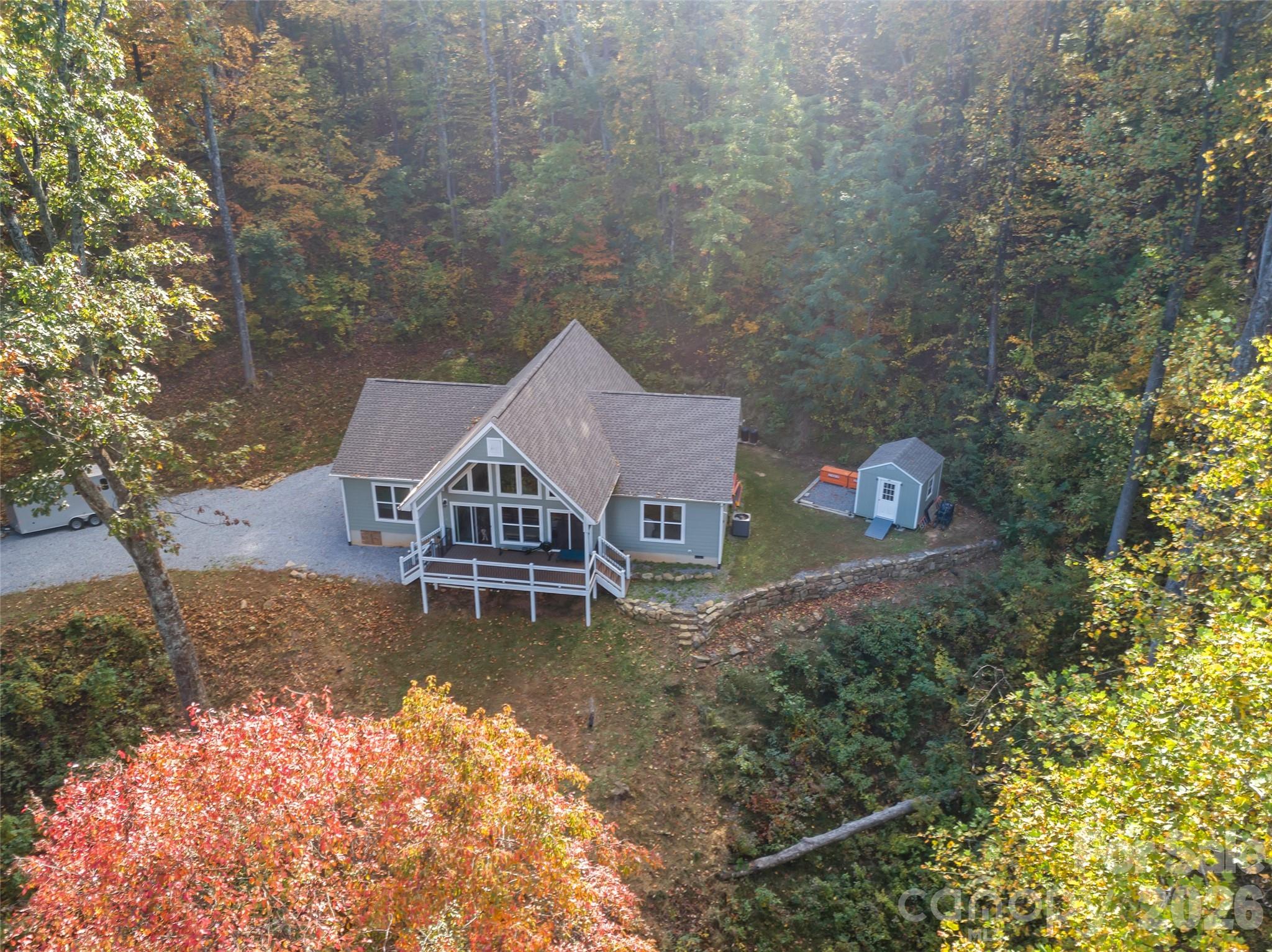 771 Sally Gap Road Old Fort, NC 28762 - Photo 26 of 44 an aerial view of a house with a yard