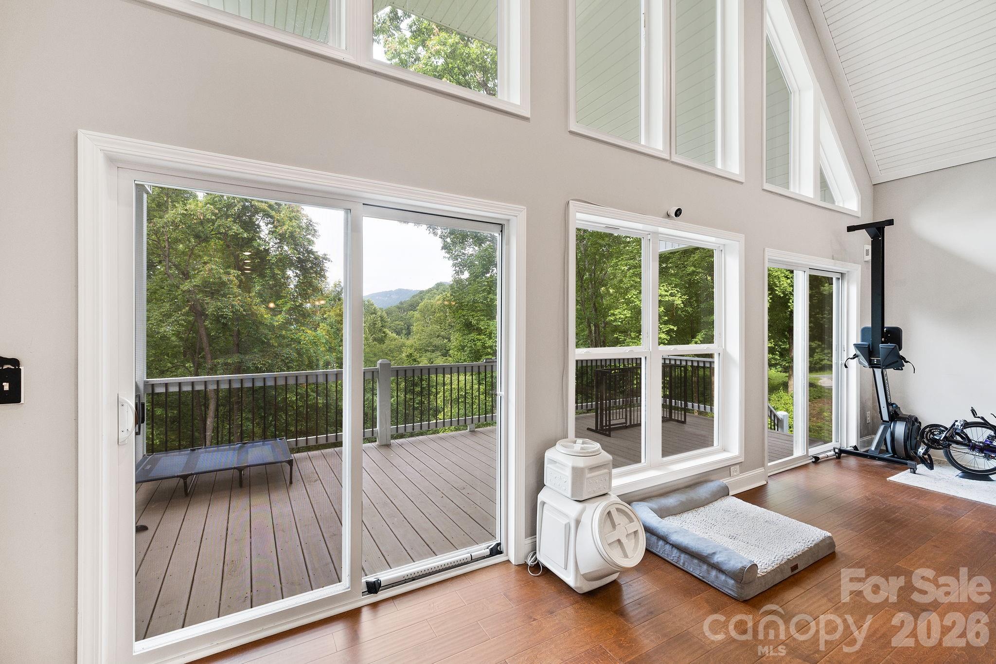 771 Sally Gap Road Old Fort, NC 28762 - Photo 3 of 44 a living room with furniture and floor to ceiling windows