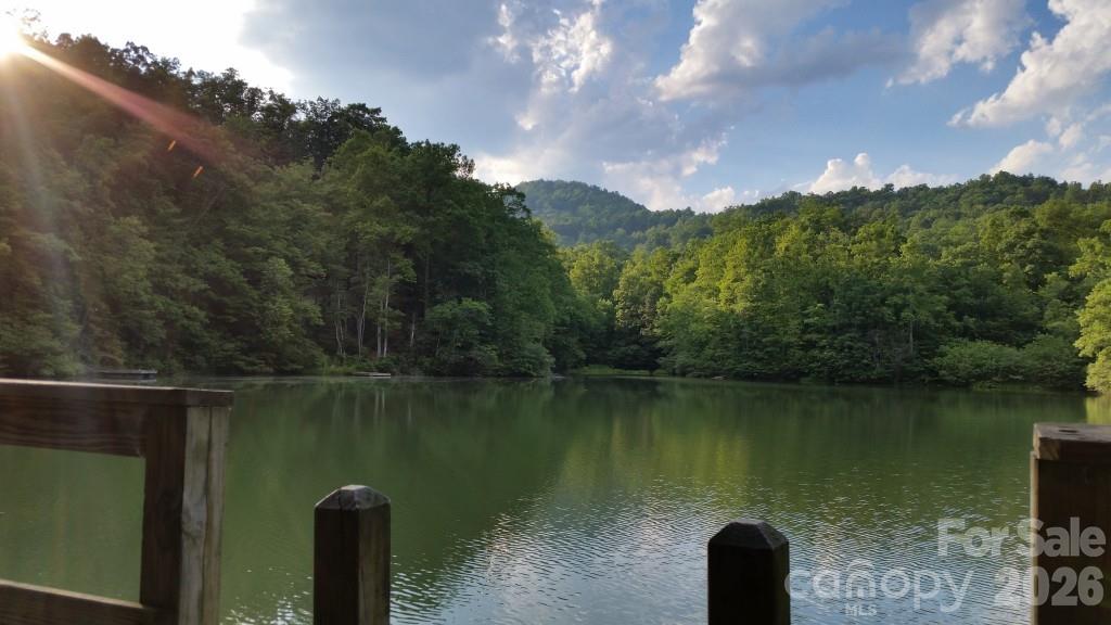 771 Sally Gap Road Old Fort, NC 28762 - Photo 36 of 44 a view of a lake with a mountain