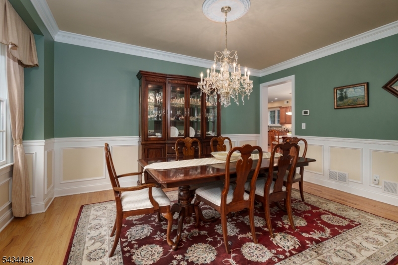 110 Orchard Road Skillman, NJ 08558 - Photo 8 of 43 a view of a dining room with furniture and chandelier