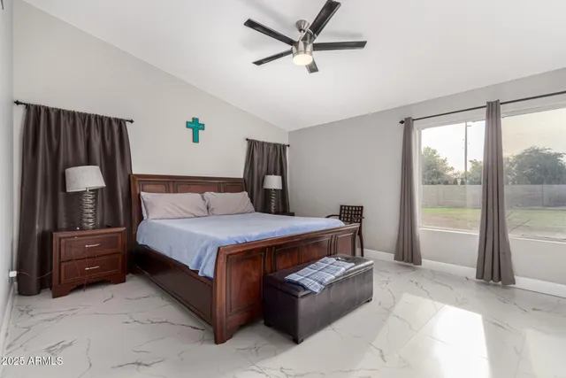 a bedroom with a bed and furniture