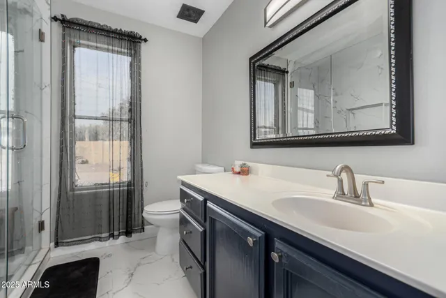 a view of a house with backyard and porch