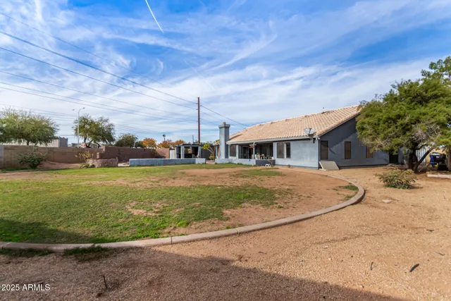 a view of yard with swimming pool and green space