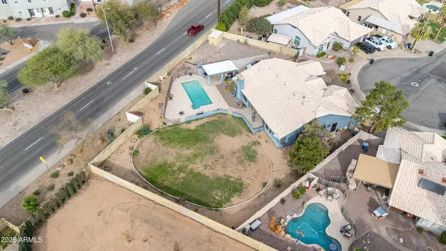 an aerial view of residential houses with outdoor space