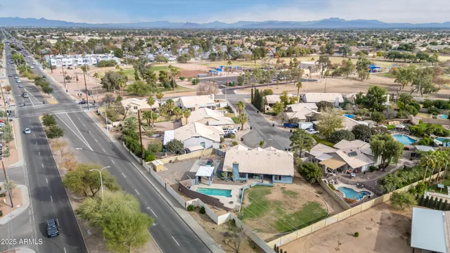 an aerial view of a house with outdoor space