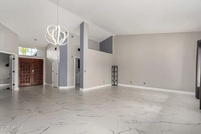 a view of a hallway with wooden shelves