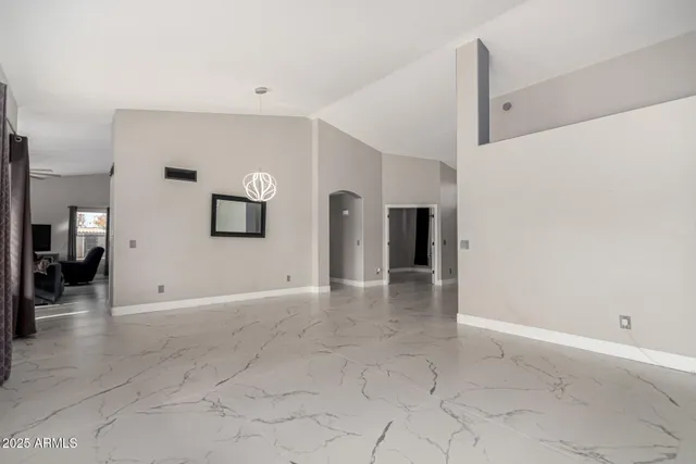 a kitchen with stainless steel appliances granite countertop a kitchen island hardwood floor sink stove and refrigerator