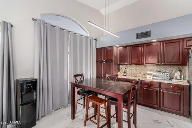 a kitchen with a sink stove and microwave