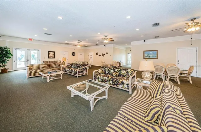 a living room with lots of furniture and view of living room