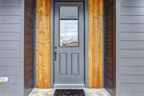 a view of front door with wooden floor