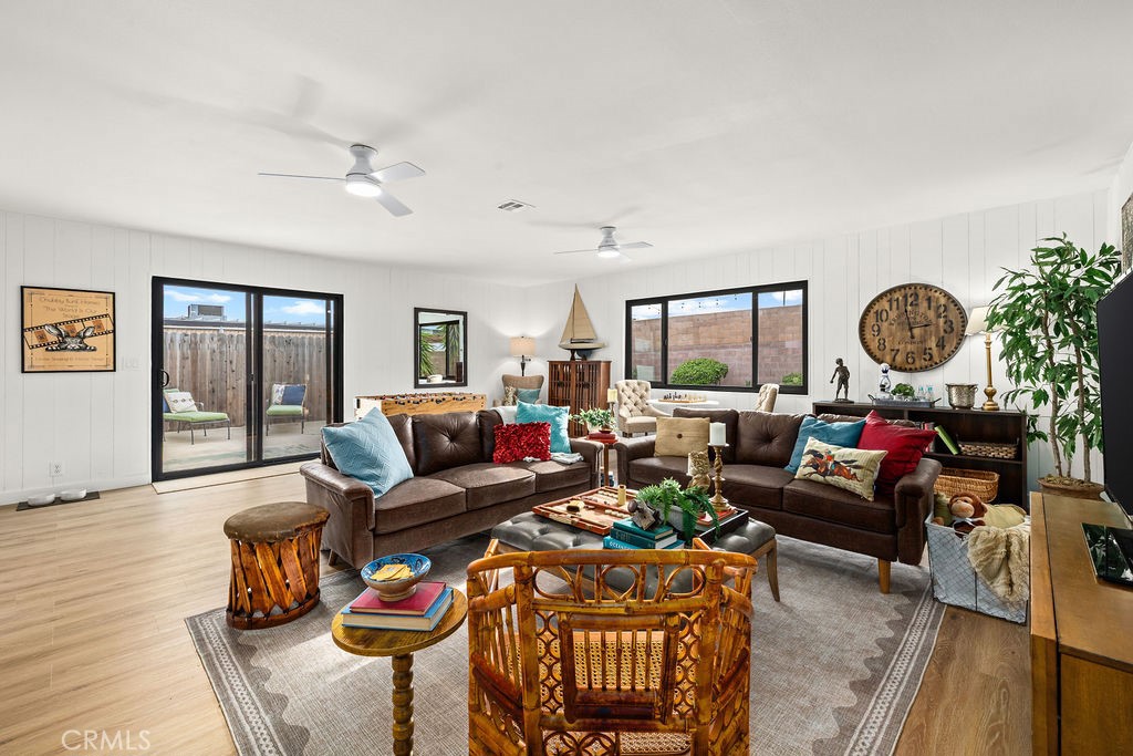 249 Alru Street Rialto, CA 92376 - Photo 13 of 33 Expansive family room with multiple seating areas and backyard access