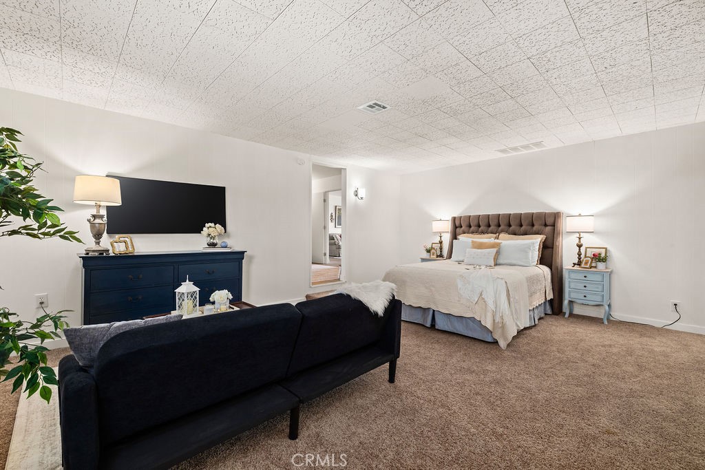 249 Alru Street Rialto, CA 92376 - Photo 16 of 33 Primary bedroom with ample space, natural light, and en-suite access