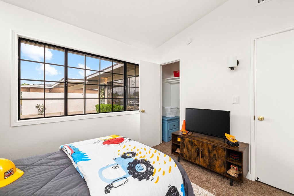 249 Alru Street Rialto, CA 92376 - Photo 19 of 33 Secondary bedroom with large window and updated flooring
