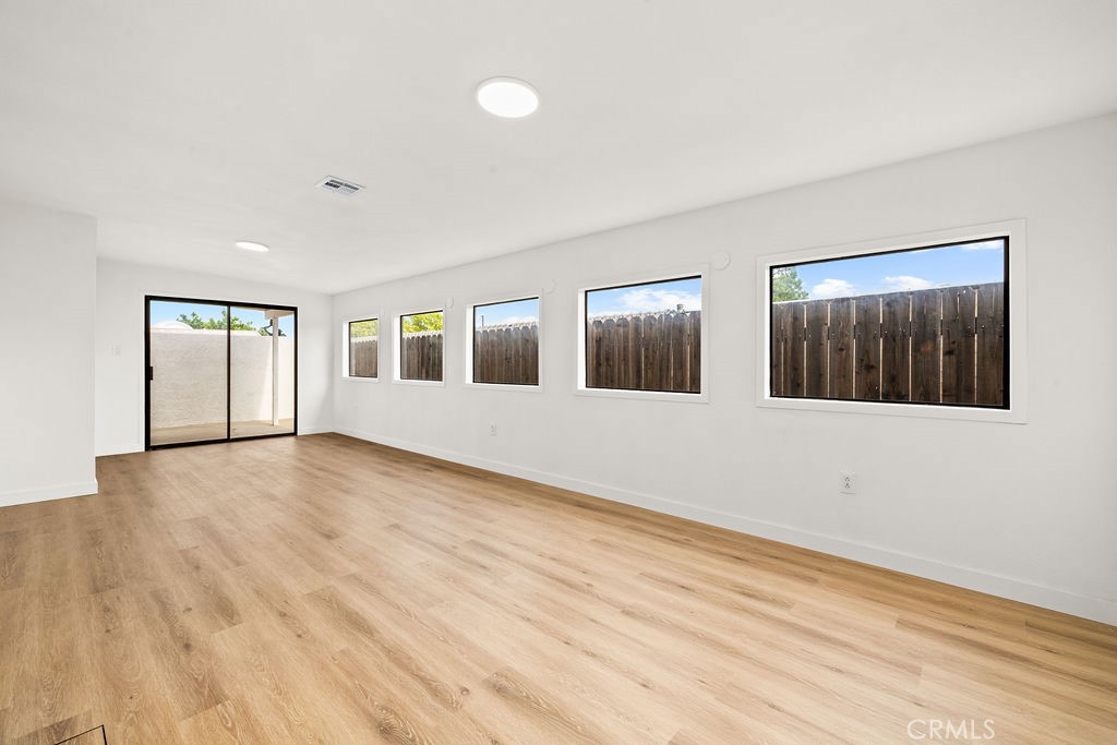 249 Alru Street Rialto, CA 92376 - Photo 21 of 33 Enclosed bonus room, laundry, or sunroom with multiple windows and backyard access
