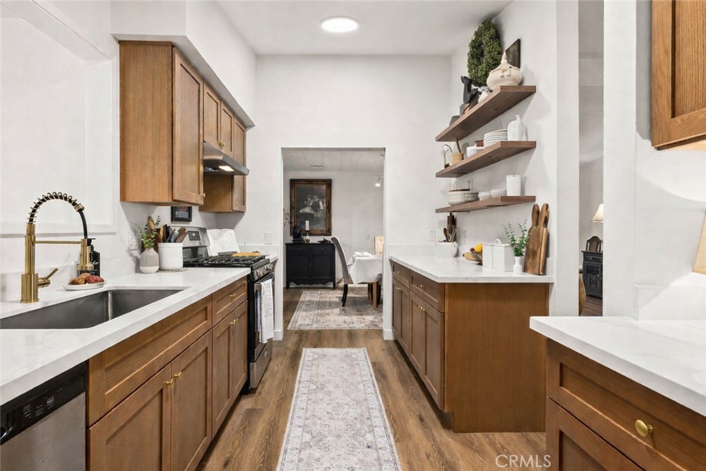 249 Alru Street Rialto, CA 92376 - Photo 4 of 33 Kitchen detail with open shelving, updated finishes, and functional layout