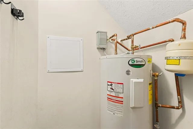 a view of storage and utility room with a refrigerator