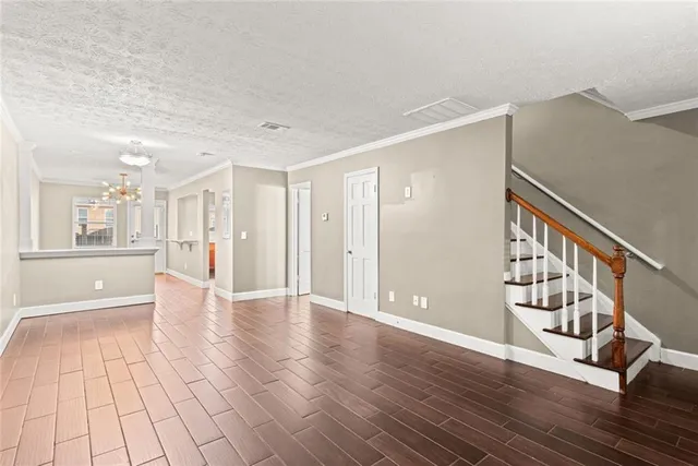 a view of an entryway with wooden floor and windows