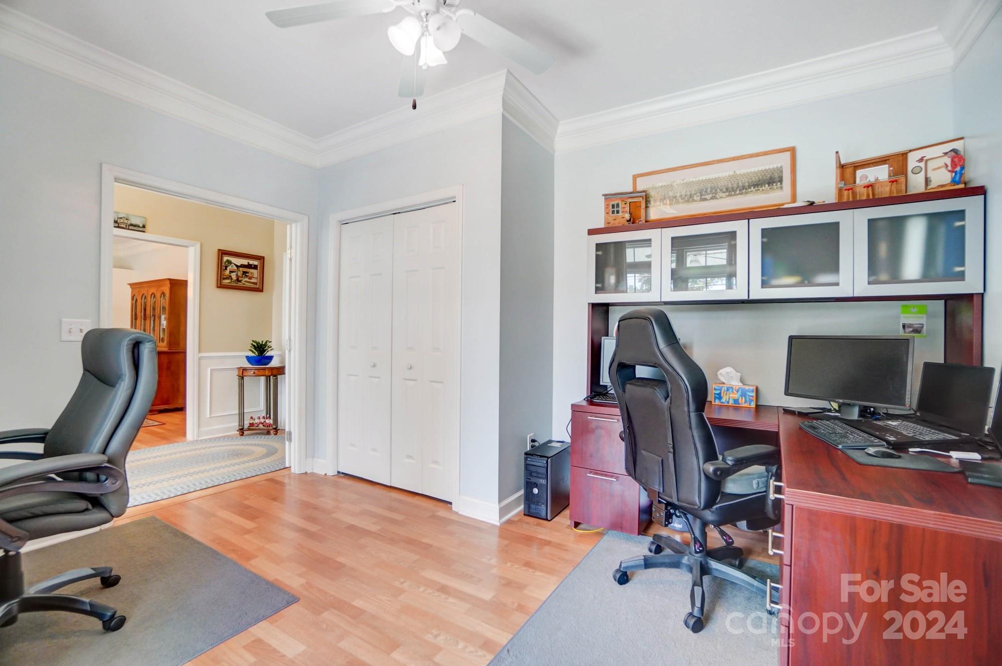 8387 Fairfield Forest Road Denver, NC 28037 - Photo 18 of 38 a workspace with furniture bookshelf and a window