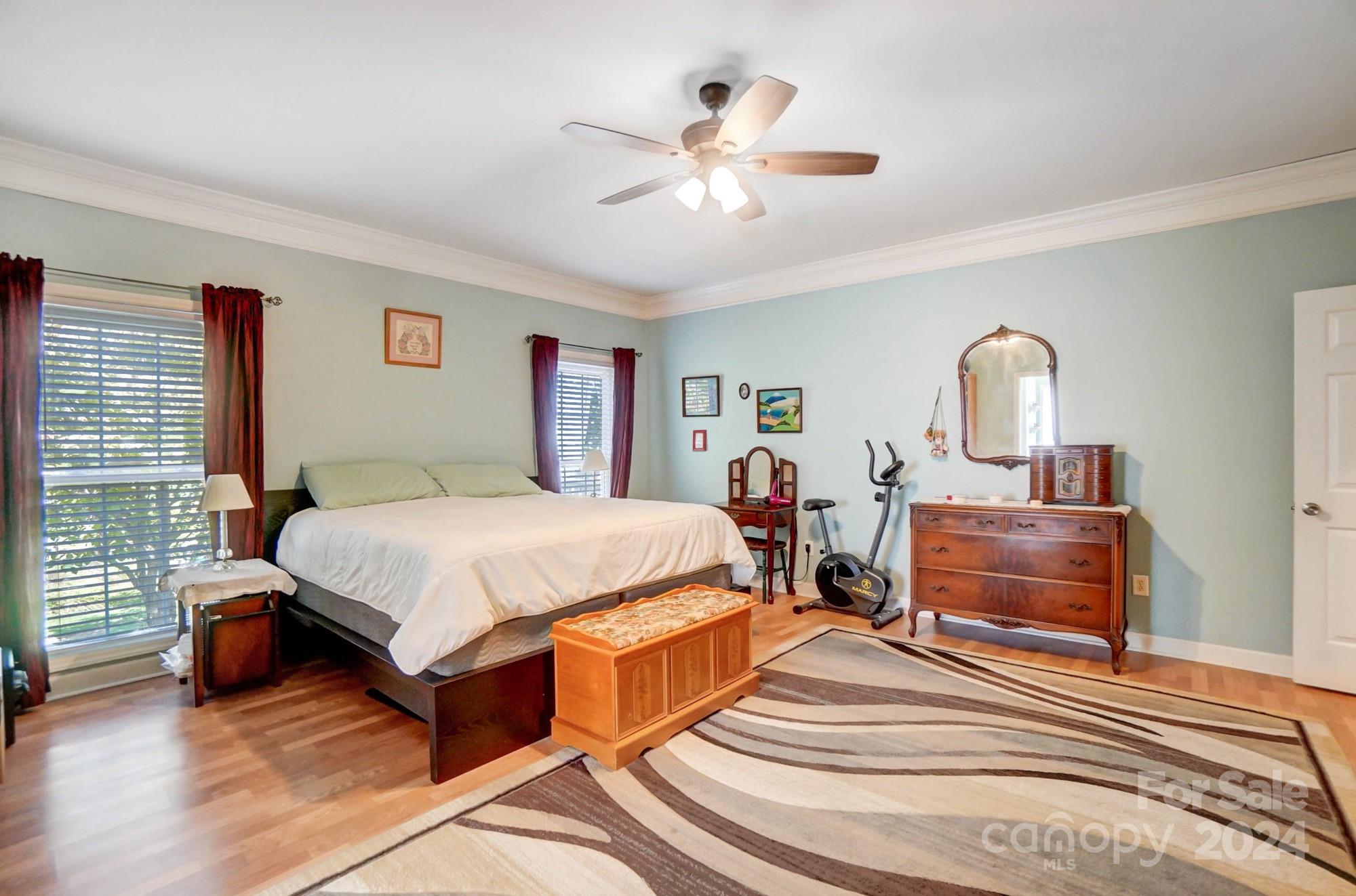 8387 Fairfield Forest Road Denver, NC 28037 - Photo 20 of 38 a bed room with a bed and a chandelier